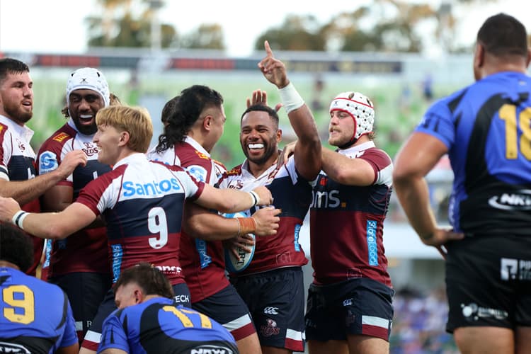 The jubilant Reds join Filipo Daugunu to celebrate the matchwinning try in Perth.